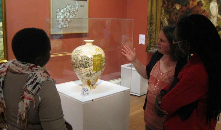 Collections Access Officer Dawn Heywood discussing a Grayson Perry pot with Freda and Jackline